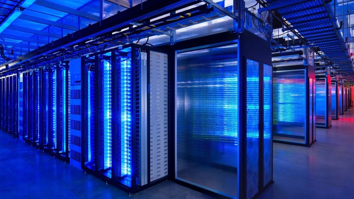 Rows of server racks in a data center hall, the kind of build-out a former bitcoin mining site is pitching to AI tenants