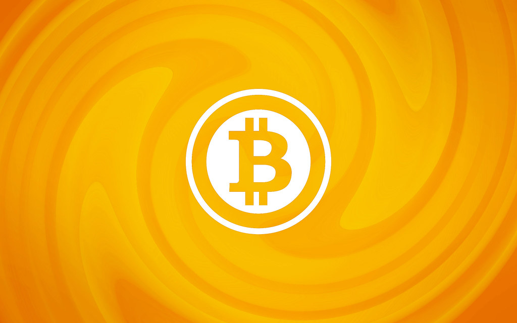 Bitcoin logo on an orange background. KULR Technology Group sold its entire bitcoin holding between July and September 2026.