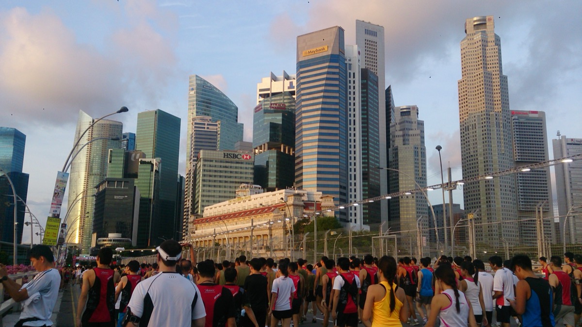 The Singapore financial district at dusk, home to StraitsX, the issuer of the XUSD stablecoin